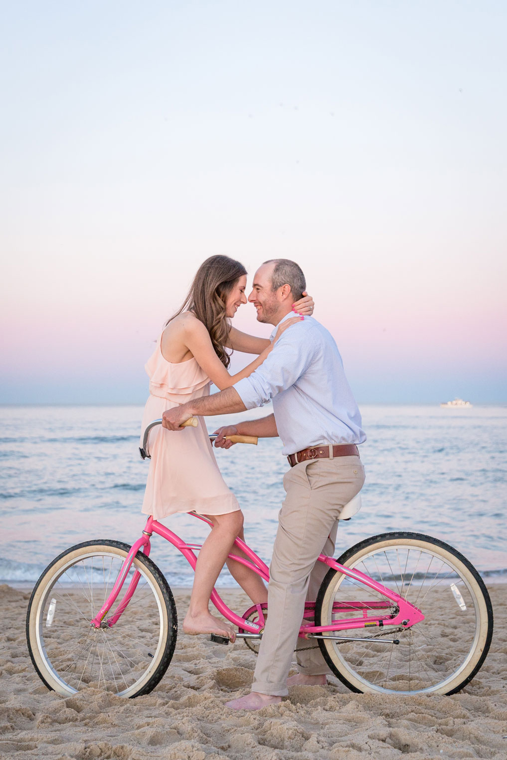 cuddling on a pink beach bike